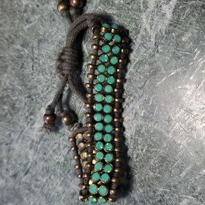 Turquoise and brass draw string bracelet with leather